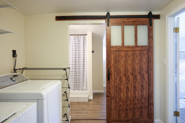 9500 Galene Dr, Louisville, KY 40299 - laundry room featuring laundry area, baseboards, wood finished floors, and washing machine and clothes dryer
