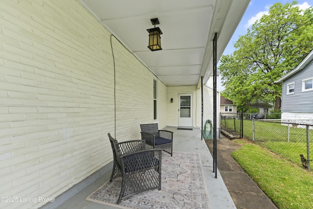 view of patio featuring fence