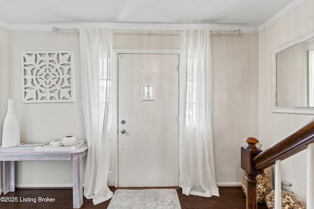 entrance foyer featuring ornamental molding and wood finished floors