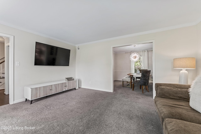 carpeted living area with crown molding, baseboards, and a notable chandelier
