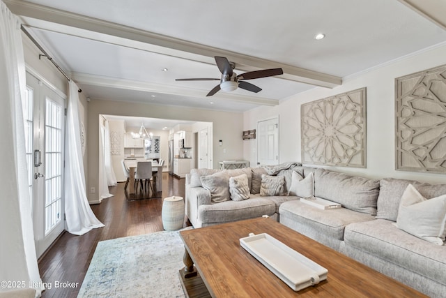living area featuring recessed lighting, beamed ceiling, ceiling fan with notable chandelier, and dark wood-type flooring