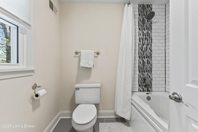 full bath with visible vents, tile patterned flooring, baseboards, toilet, and shower / bath combo with shower curtain