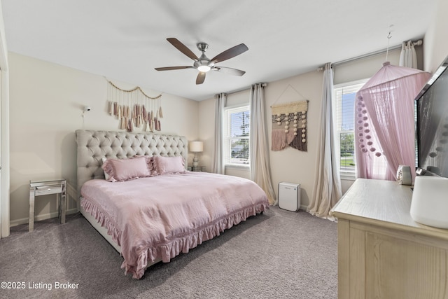 carpeted bedroom with baseboards, multiple windows, and ceiling fan