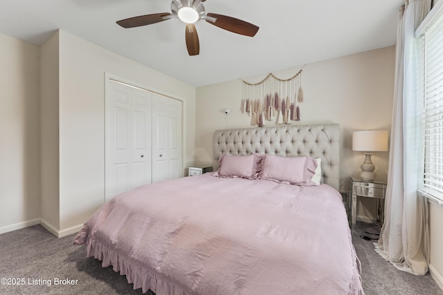 bedroom with a ceiling fan, baseboards, carpet, and a closet