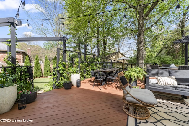 wooden deck featuring outdoor dining space