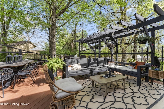 wooden terrace with a pergola, outdoor lounge area, and outdoor dining area