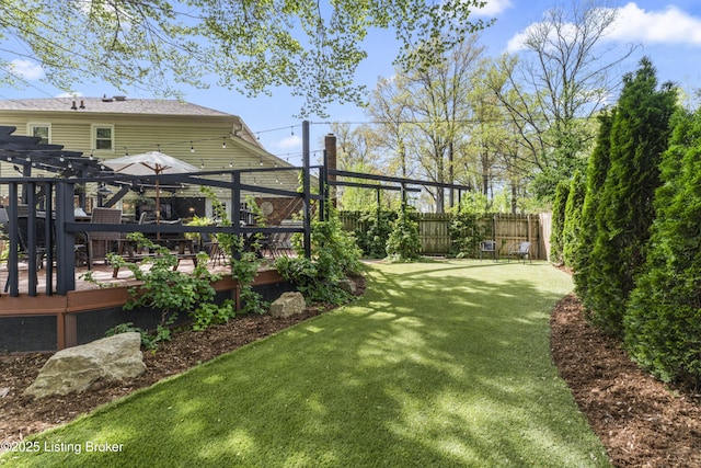 view of yard featuring fence, a pergola, and a wooden deck