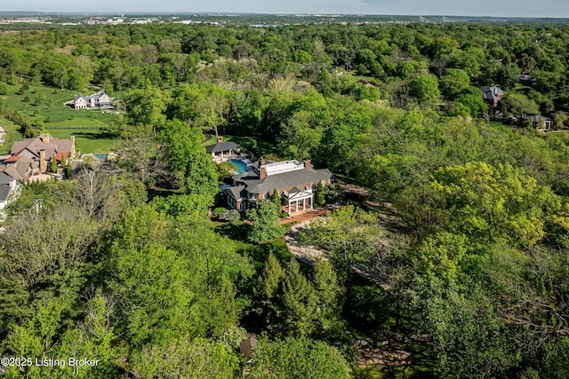 bird's eye view featuring a wooded view