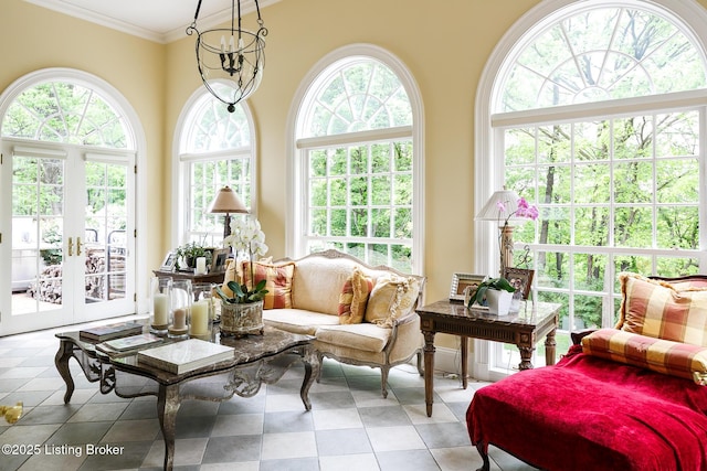 sunroom with plenty of natural light and french doors