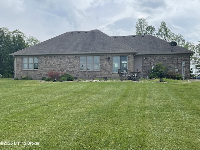 928 Old Nazareth Rd, Bardstown, KY 40004 - back of house featuring a shingled roof, brick siding, and a lawn