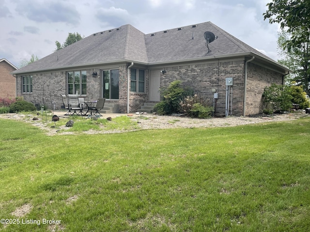 928 Old Nazareth Rd, Bardstown, KY 40004 - rear view of house with entry steps, brick siding, a lawn, and a patio area