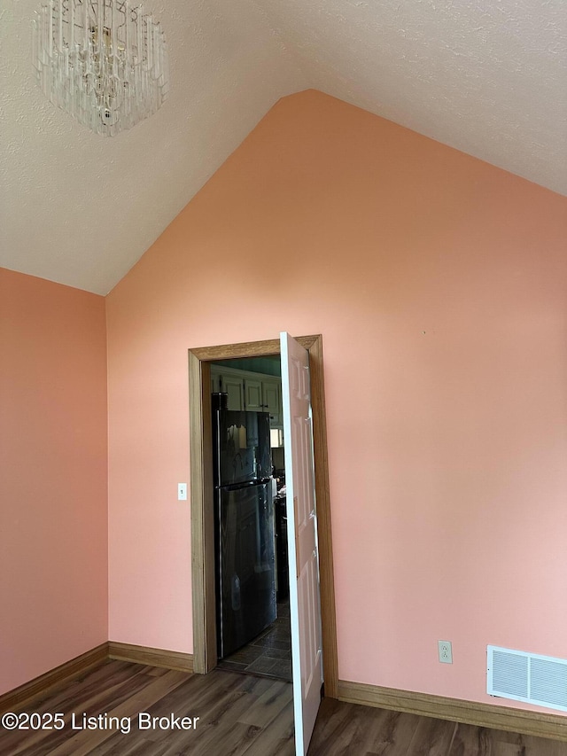 928 Old Nazareth Rd, Bardstown, KY 40004 - hallway with dark wood-type flooring, vaulted ceiling, and baseboards