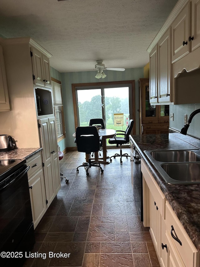 928 Old Nazareth Rd, Bardstown, KY 40004 - kitchen with a sink, electric range, a desk, ceiling fan, and dark countertops