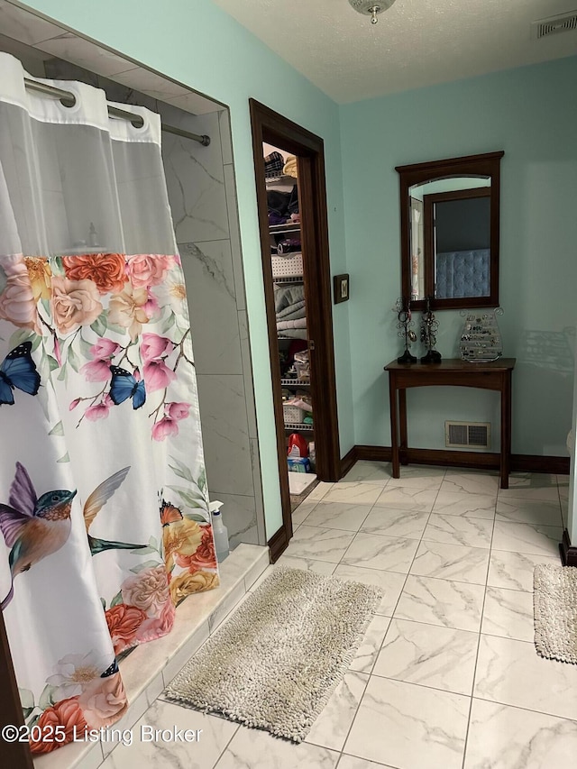 928 Old Nazareth Rd, Bardstown, KY 40004 - bathroom with marble look tile flooring, a shower with curtain, and baseboards