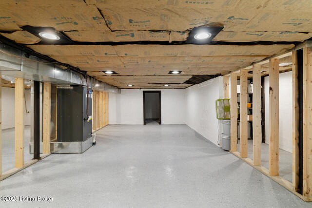 unfinished basement with heating unit