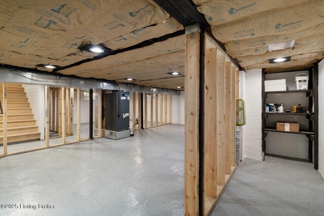unfinished below grade area featuring stairway