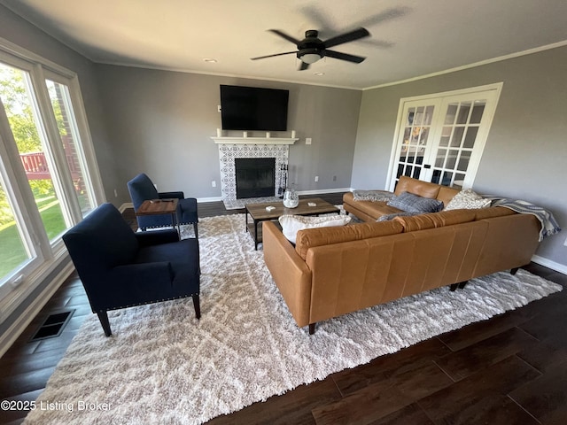 3115 Wynbrooke Cir, Louisville, KY 40241 - living area featuring baseboards, wood finished floors, a ceiling fan, a tiled fireplace, and ornamental molding