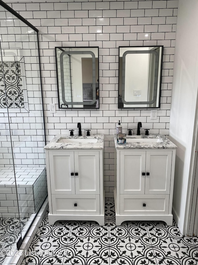 3115 Wynbrooke Cir, Louisville, KY 40241 - full bathroom with tile patterned flooring, a stall shower, two vanities, and tile walls