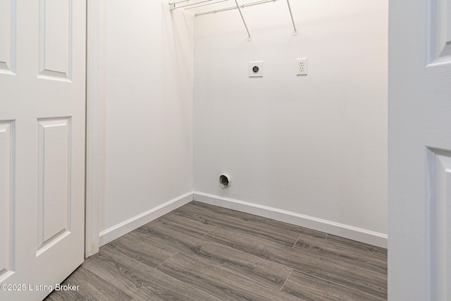 laundry room with laundry area, dark wood-style flooring, baseboards, and hookup for an electric dryer