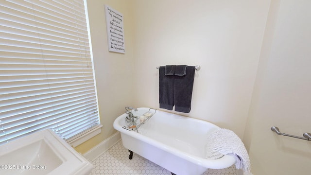 1223 S 1st St, Louisville, KY 40203 - full bathroom with a freestanding bath, tile patterned flooring, and baseboards
