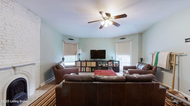 1223 S 1st St, Louisville, KY 40203 - living room featuring plenty of natural light, ceiling fan, a fireplace, and baseboards