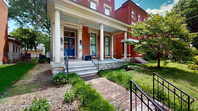 1223 S 1st St, Louisville, KY 40203 - entrance to property with brick siding, a porch, and a yard