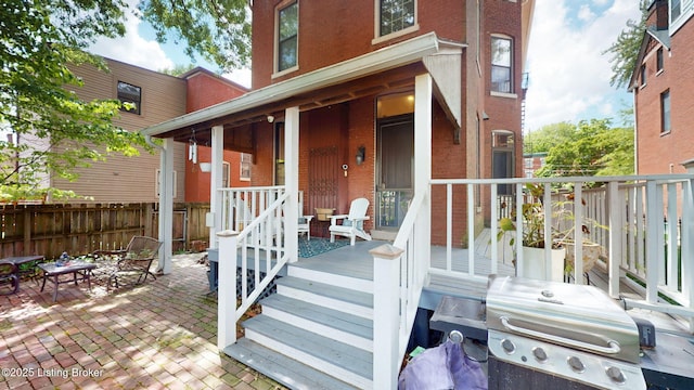 1223 S 1st St, Louisville, KY 40203 - property entrance featuring brick siding, fence, and covered porch
