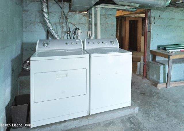 clothes washing area featuring laundry area and washing machine and dryer