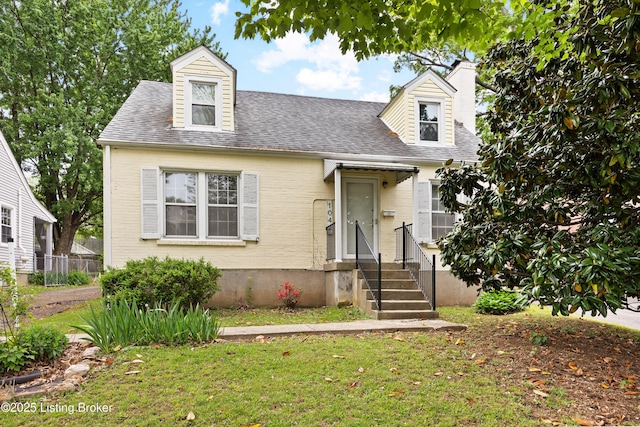 1042 Parkway Dr, Louisville, KY 40217 - cape cod home with roof with shingles, fence, a chimney, and a front yard