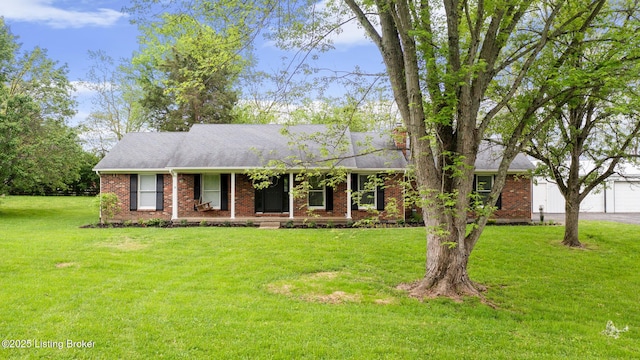 1614 W Reel Dr, La Grange, KY 40031 - single story home with a front yard, brick siding, a garage, roof with shingles, and covered porch