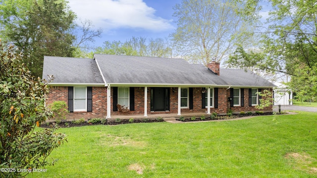 1614 W Reel Dr, La Grange, KY 40031 - view of front of property with covered porch, a front yard, brick siding, and a chimney