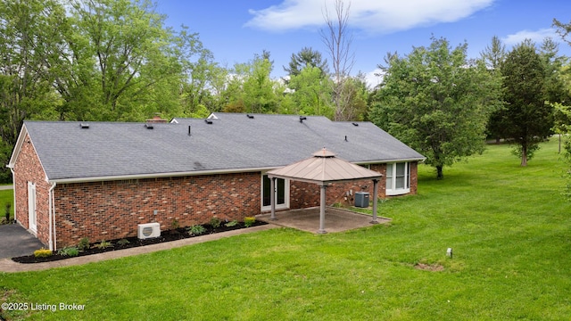 1614 W Reel Dr, La Grange, KY 40031 - back of house featuring brick siding, a patio, a yard, and roof with shingles