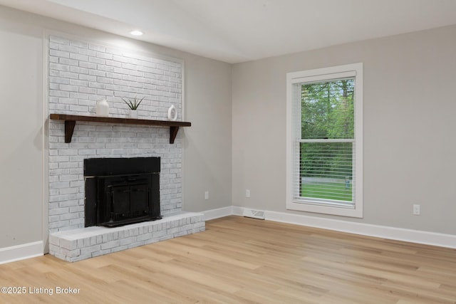 1614 W Reel Dr, La Grange, KY 40031 - unfurnished living room featuring wood finished floors, baseboards, recessed lighting, and a brick fireplace