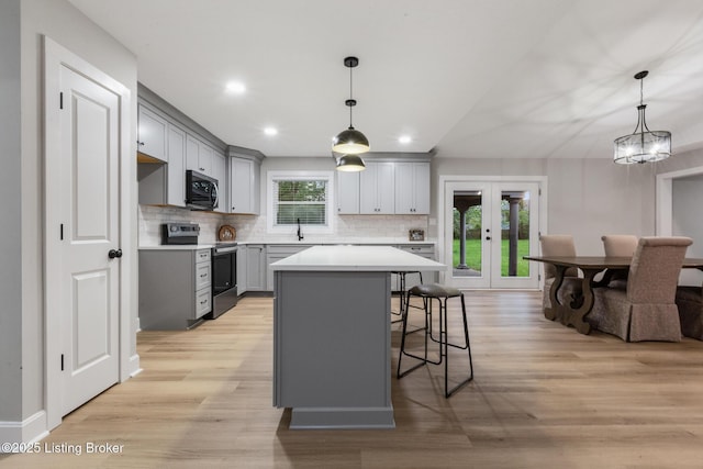 1614 W Reel Dr, La Grange, KY 40031 - kitchen with stainless steel appliances, gray cabinetry, tasteful backsplash, light wood-type flooring, and recessed lighting