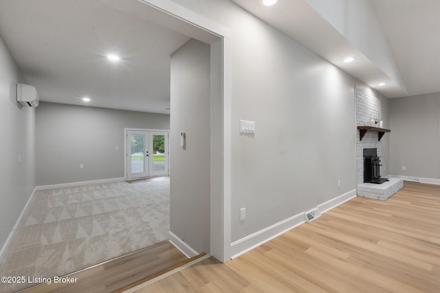 1614 W Reel Dr, La Grange, KY 40031 - hall with a wall unit AC, wood finished floors, baseboards, and recessed lighting