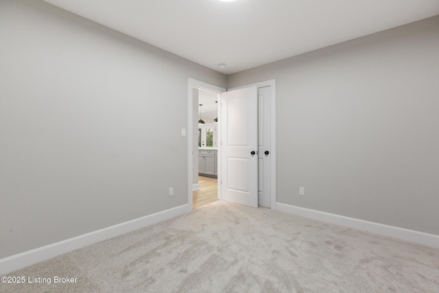 1614 W Reel Dr, La Grange, KY 40031 - spare room with baseboards and light colored carpet