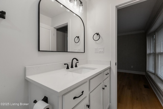 1614 W Reel Dr, La Grange, KY 40031 - bathroom with wood finished floors, ornamental molding, vanity, and baseboards