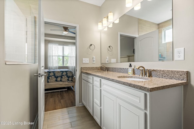 4107 Cobblestone Ln, La Grange, KY 40031 - full bathroom featuring double vanity, a sink, a ceiling fan, and wood finished floors