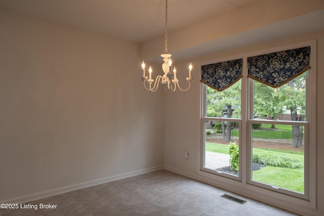unfurnished dining area featuring baseboards, light tile patterned flooring, a chandelier, and visible vents