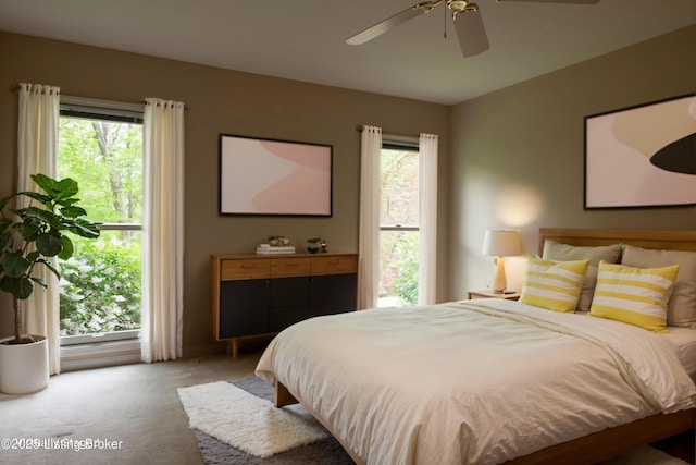 bedroom with baseboards, ceiling fan, and light colored carpet