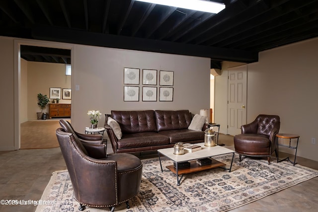 living area with beamed ceiling