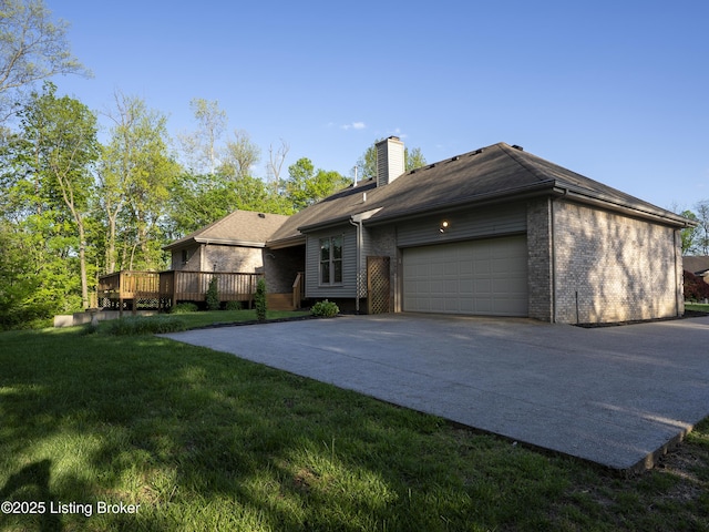 exterior space with a chimney, a wooden deck, brick siding, a front lawn, and an attached garage