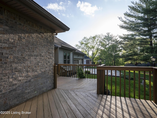 deck featuring a yard