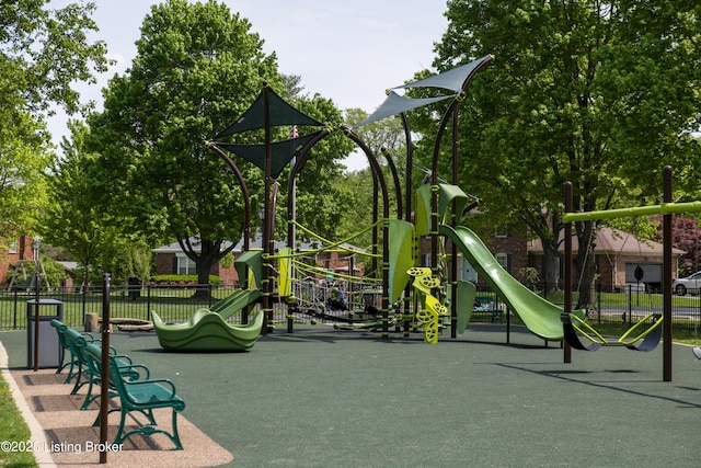 community jungle gym featuring fence