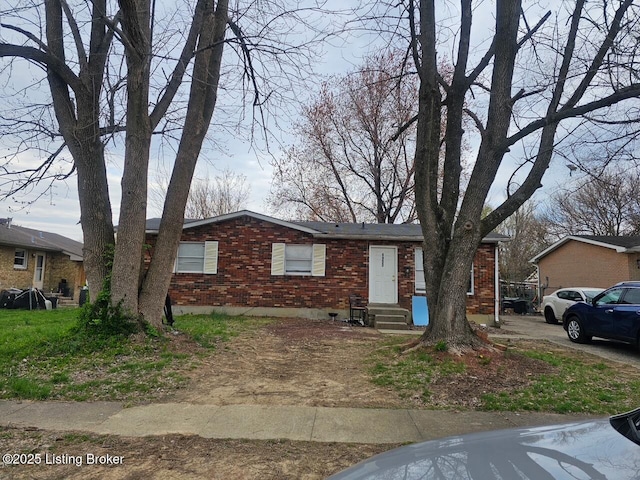 single story home with brick siding and entry steps