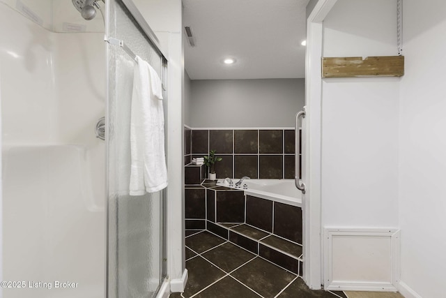 full bath with recessed lighting, tile patterned floors, a garden tub, and a stall shower