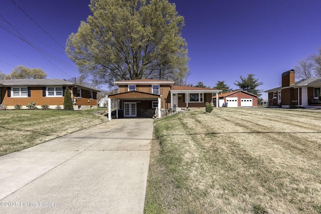 tri-level home featuring french doors, a garage, brick siding, a front lawn, and concrete driveway