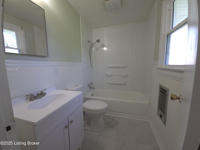 full bathroom with vanity, wainscoting, toilet, and marble finish floor