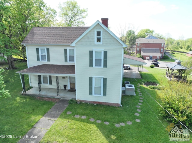 116 Lebanon Hl, Springfield, KY 40069 - view of front of property featuring covered porch, a front yard, roof with shingles, a chimney, and a gazebo