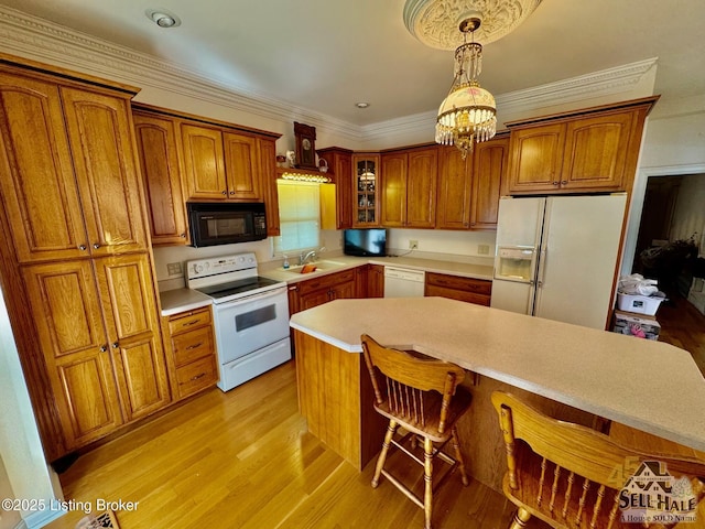 116 Lebanon Hl, Springfield, KY 40069 - kitchen with white appliances, a breakfast bar, brown cabinetry, and a sink